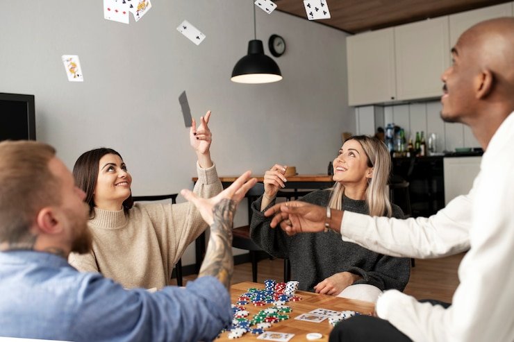 Game meja klasik seperti poker dan baccarat di layar dengan dealer live